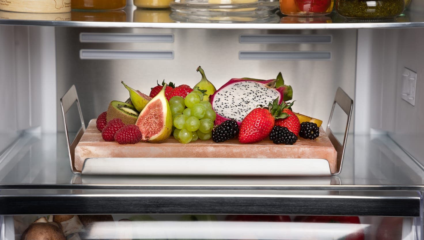 Fruit platter on a fridge shelf